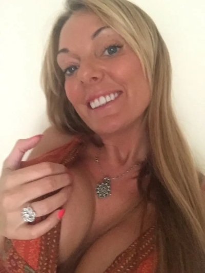 Slutty MILF with big fake tits